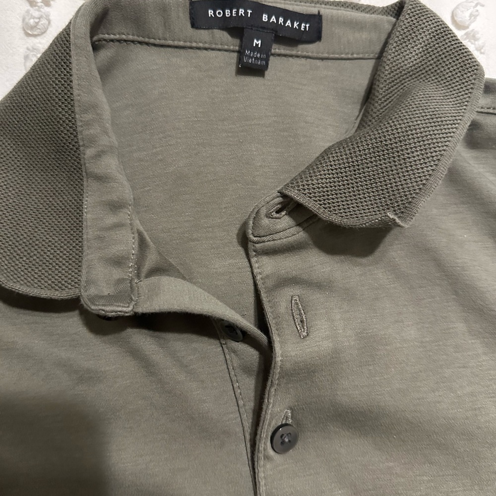 Robert bracket long sleeve polo shirt. Color is a deep green
